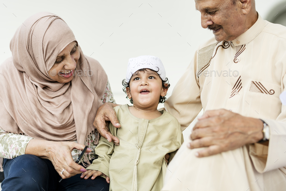 Muslim grandparents with their grandchild - Stock Photo - Images