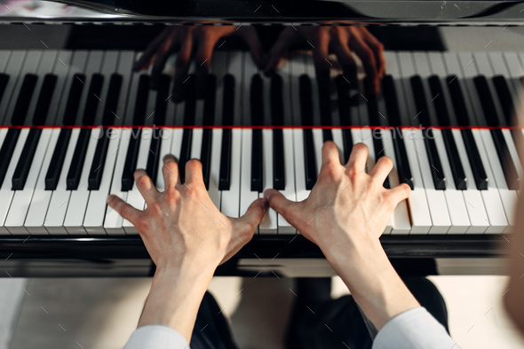 Male pianist hands on grand piano keyboard Stock Photo by NomadSoul1