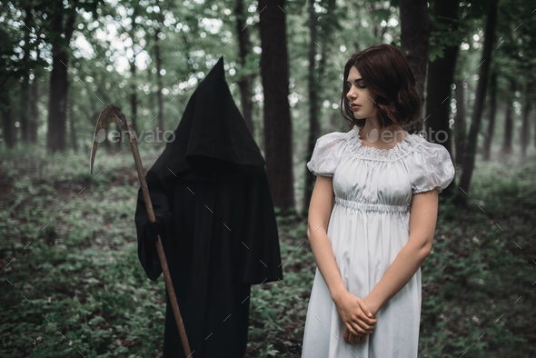 Death swinging a scythe on young female victim - Stock Photo - Images