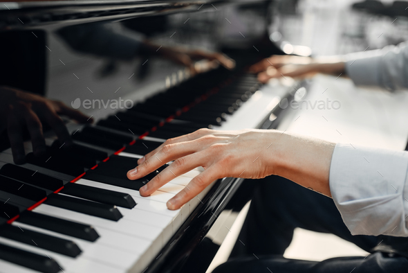 Male pianist hands on grand piano keyboard Stock Photo by NomadSoul1