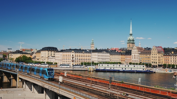 The Cityscape of Stockholm, in the Foreground the Train Passes. Transport in the Capital of Sweden alt