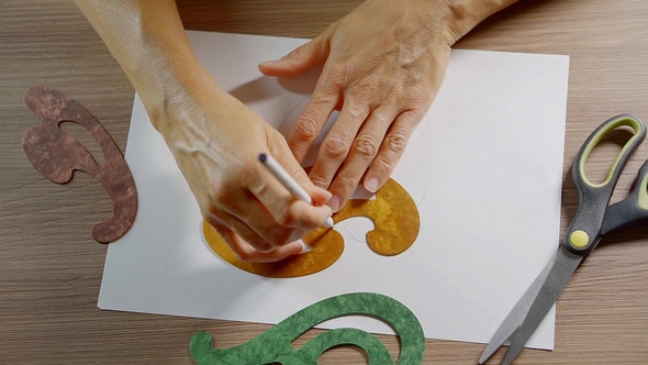 Shot From Above of a Hand's of Female Artist Drawing Interesting Shapes on Paper alt