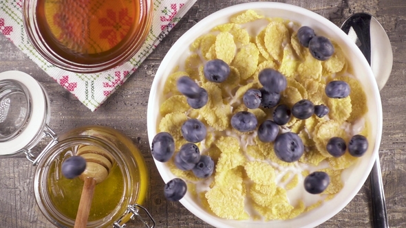 Ready Breakfast with Milk, Honey and Berries Top View