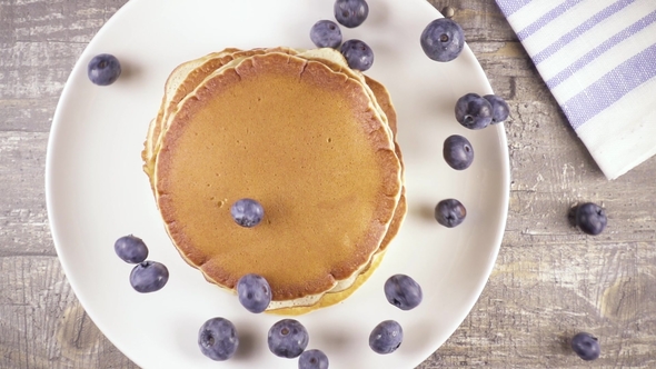 Pancakes for Breakfast with Berries and Honey Top View