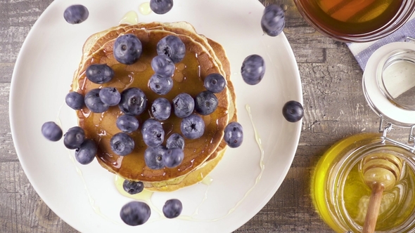 Pancakes for Breakfast with Berries and Honey Top View