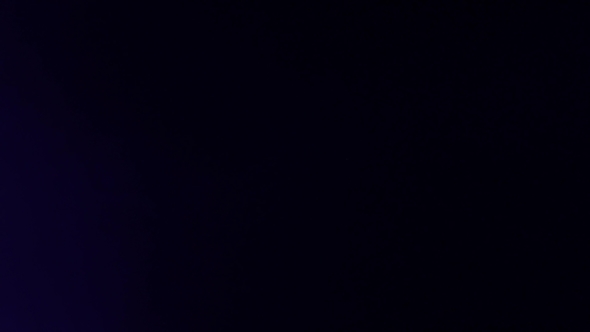 Rays of Colorful Light in a Dark Room From Lanterns alt