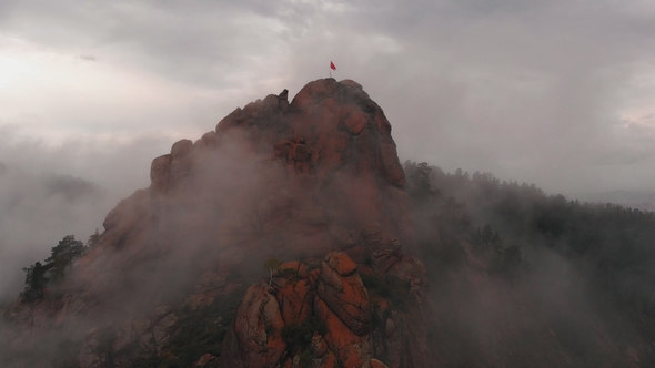 Aerial View of Fog Among the Mountain Peaks alt