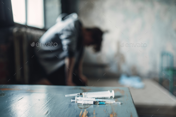 Syringe and spoon for dose preparing on the table - Stock Photo - Images