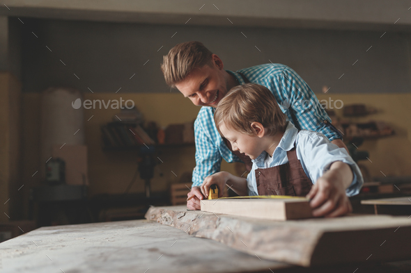 Father and son at work Stock Photo by AboutImages | PhotoDune