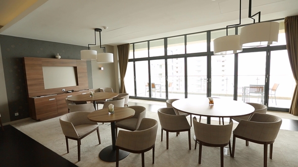 Interior Lounge Area with Table, Chairs and Panoramic Windows alt