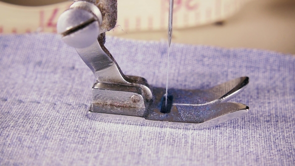 The Needle of the Sewing Machine Makes Stitches