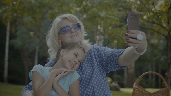 Positive Grandmother Making Selfie with Grandchild alt
