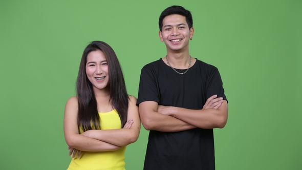 Young Asian Couple with Arms Crossed Together, Stock Footage | VideoHive