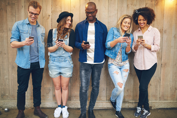 Friends using smartphones - Stock Photo - Images