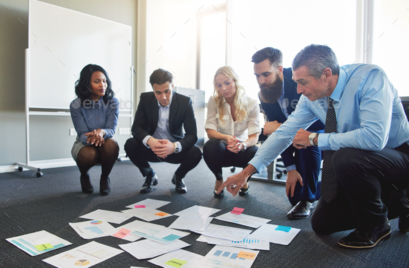 Business team brainstorming in office Stock Photo by FlamingoImages