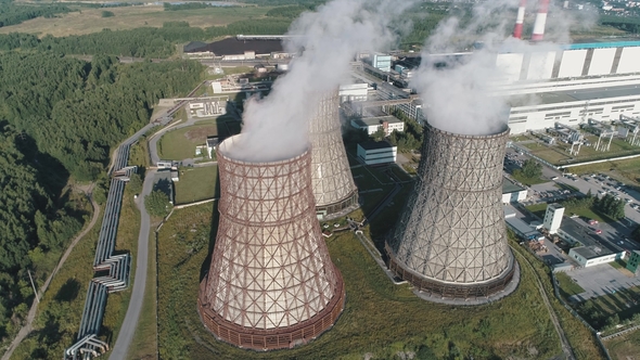 Aerial View on the Working Power Station Cooling Tower of Nuclear Power Plant. Coal-burning Power