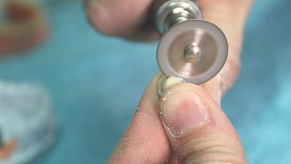 Lab Technician Cut Dental Prothesis alt