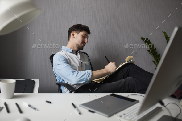 Designer drawing design project. - Stock Photo - Images