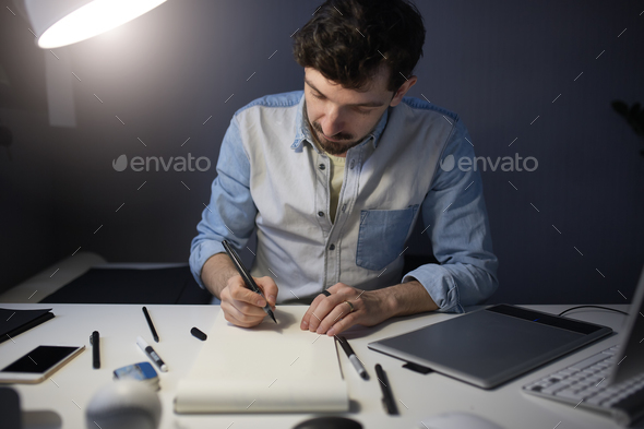 Designer drawing design project. - Stock Photo - Images