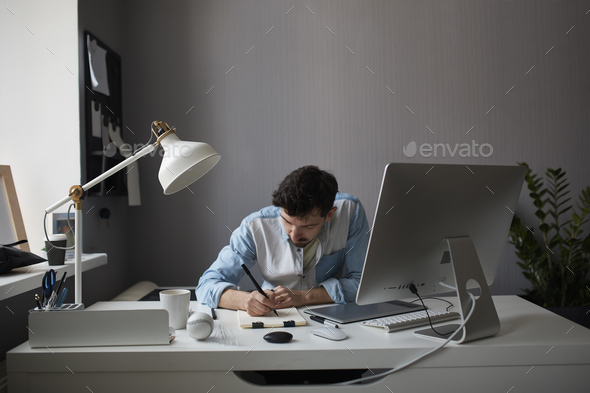Designer drawing design project. - Stock Photo - Images