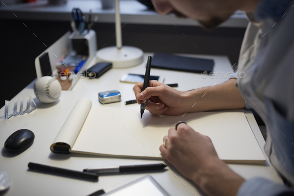 Designer drawing design project. - Stock Photo - Images