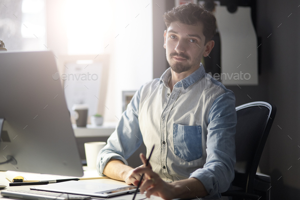 Portrait of young confident entrepreneur - Stock Photo - Images