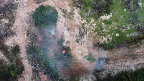 Aerial view tractor involve in open burning of oil palm tree alt