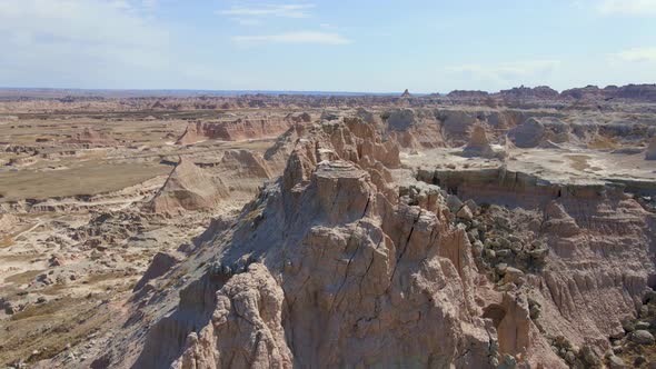 Fly over Badlands National Park on a sunny day alt