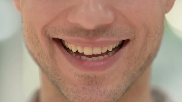 Close Up of Mouth of Smiling Creative Young Man alt