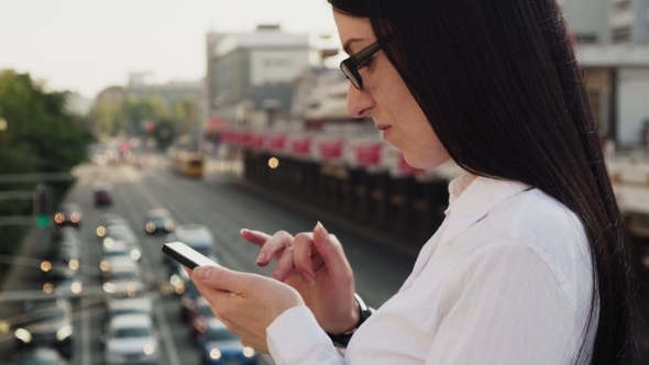 Confident Business Woman Using Smartphone Working at City Street