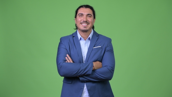 Handsome Businessman Smiling with Arms Crossed alt