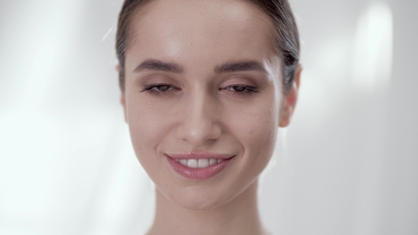 Woman's Face Care. Smiling Female Touching Skin On Face, Stock Footage