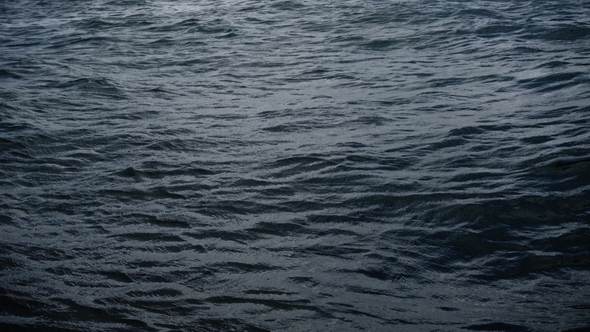 Fly Over Disturbed Ocean Water Surface alt