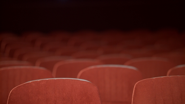 Empty Cinema Chair Before Premiere. Rows of Empty Seats in Movie Theatre alt