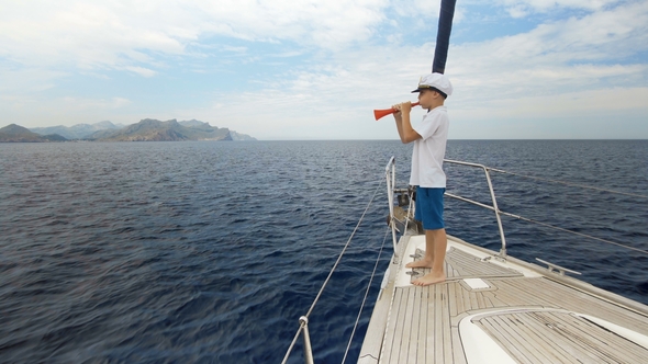 Summer Picture. A Happy Boy in a Cap Is Standing on the Yacht and Counting the Number of Yachts That alt