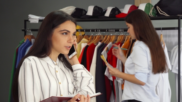 Beautiful Female Shop Assistant Talking on the Phone, Working at the ...