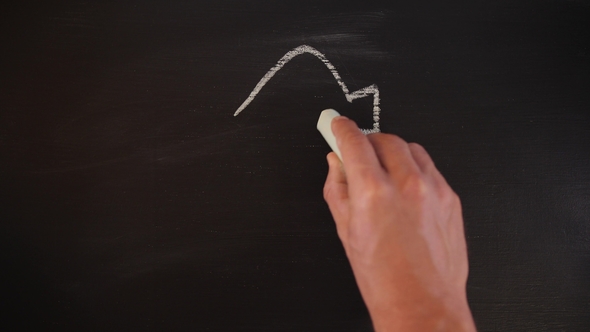 Man Drawing Recycle Sign with Chalk on Blackboard. Recycling  Concept Background.