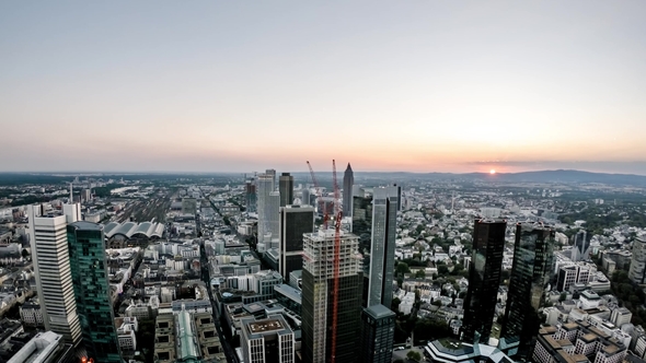Aerial  of the Frankfurt / Main Skyline and Site of a Skyscraper During Sunset on a Hot Summer Day alt