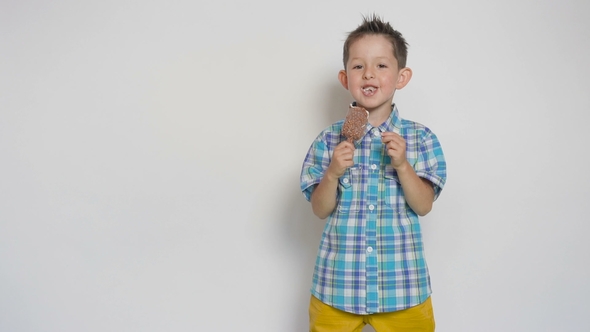 Excited Kid with Chocolate Ice Cream Bar, Five Years Old, on White Background