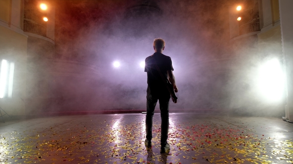 The Guitarist Performs on Stage. Stage Light, Smoke alt