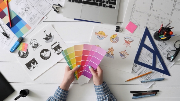 Creative Designer Choosing Color Palette for Logo Design