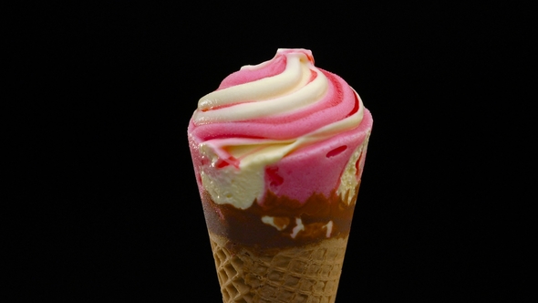 Strawberry Ice Cream Cone Over Black Background