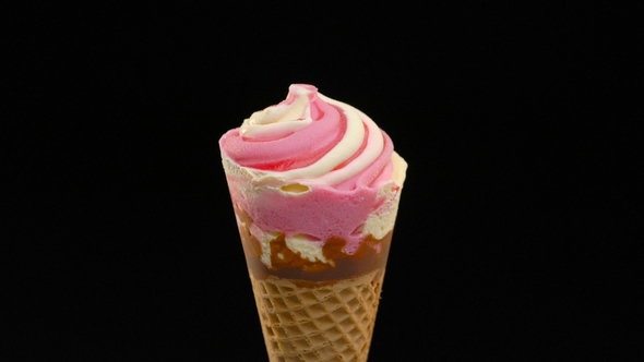 Pink Ice Cream in a Waffle Cone on a Dark Background