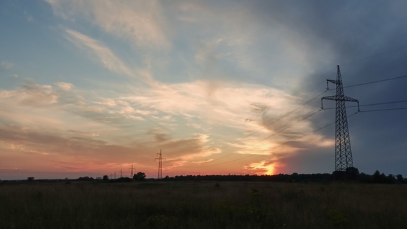 of a Sunset with Electrical Cables and Utility Poles. Video Footage in Full