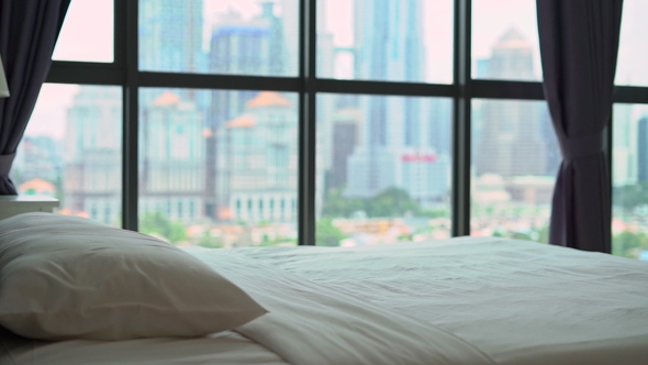 Superslowmotion Shot of a Young Man Falling on a Bed alt
