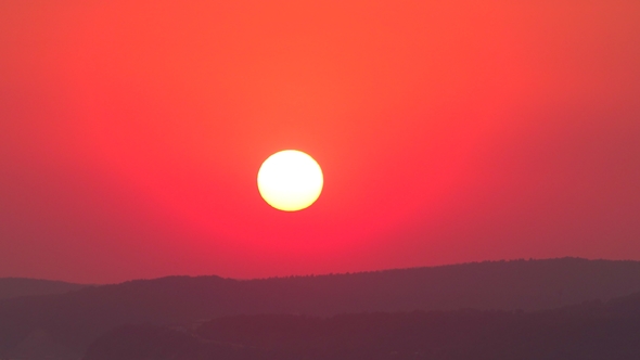 Large Disk of the Setting Sun. .