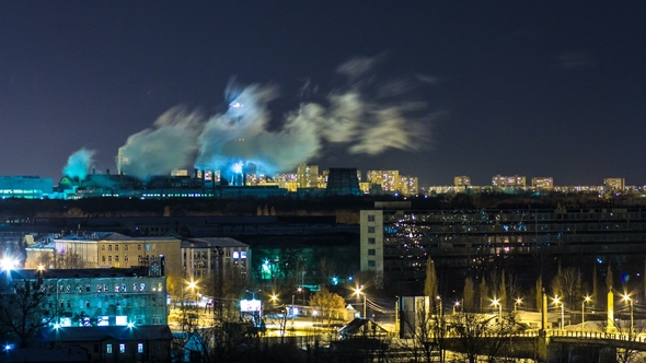 Pipes with Smoke and Residential Apartment Buildings . alt