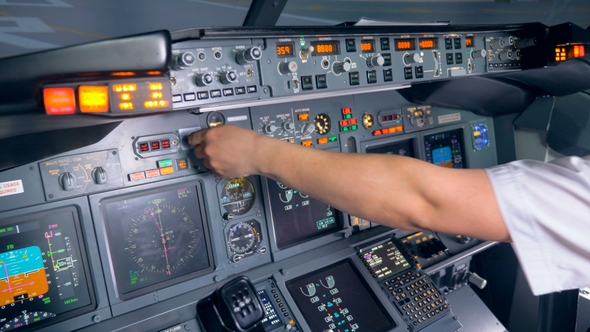 Indicators of an Aircraft Console Are Getting Switched on and Off By a Pilot alt