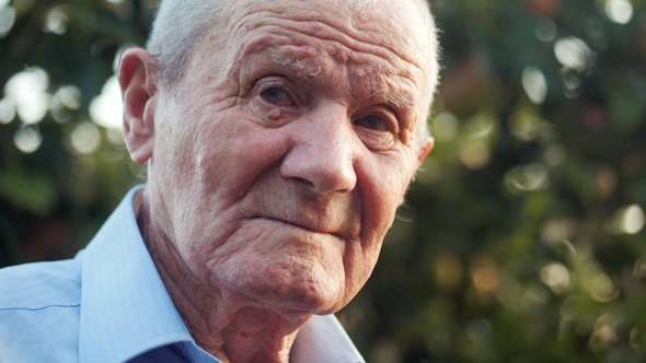 Very Old Man Portrait with Emotions. Grandfather Is Smiling and Looking To Camera. Portrait: Aged alt
