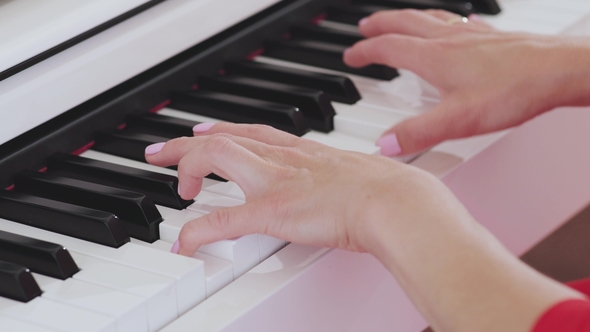 Woman Hands Playing the Piano alt